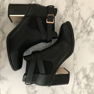 Black booties with gold details